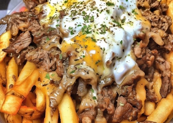 EspañolPapas fritas con queso Philly Steak